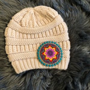 Women tan beautiful quality knitted winter hat w beaded medallion .